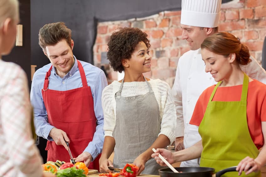 Group of people taking a cooking class
